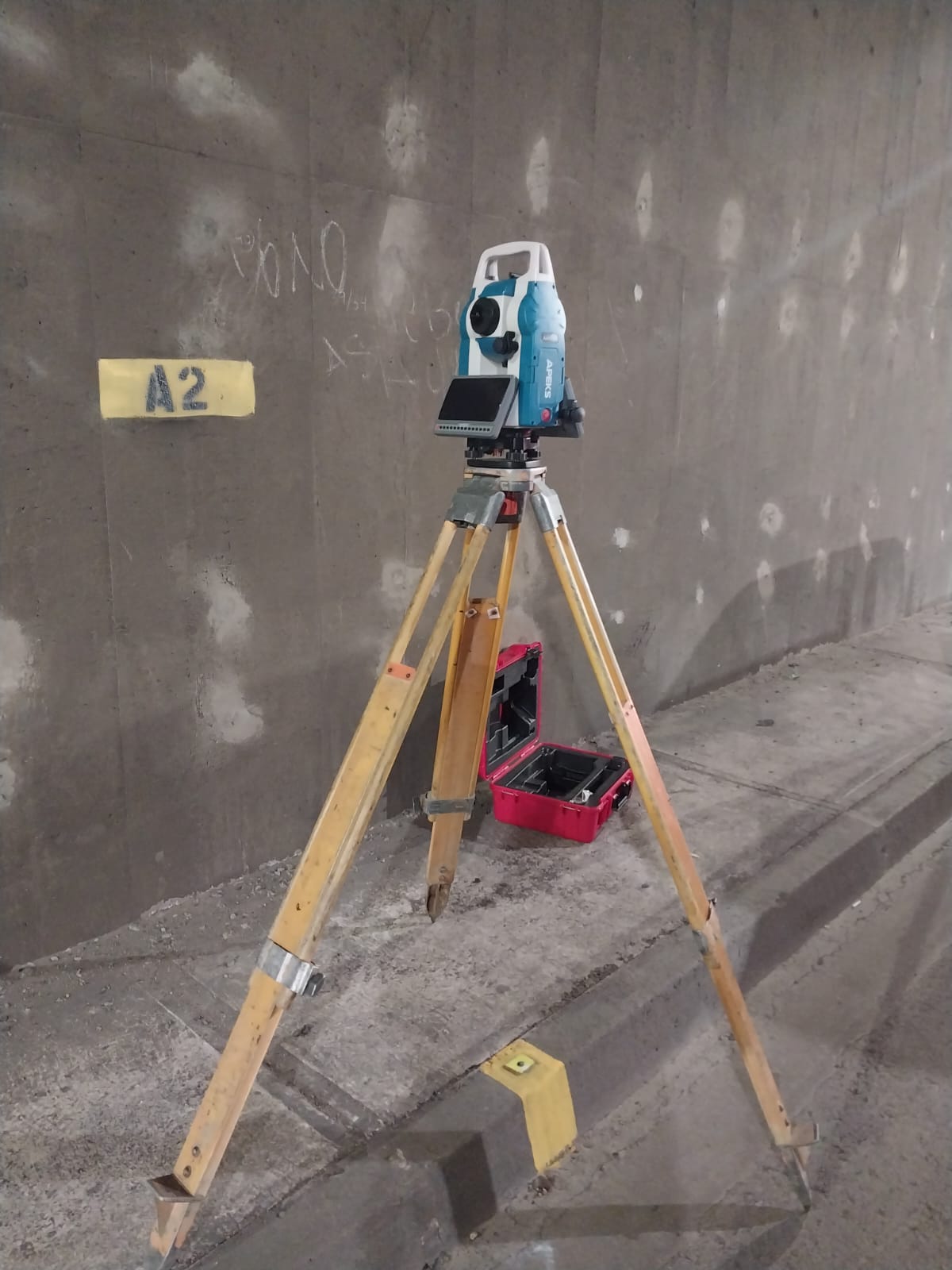 APEKS AM02i Android total station used inside a highway tunnel construction site in Chile
