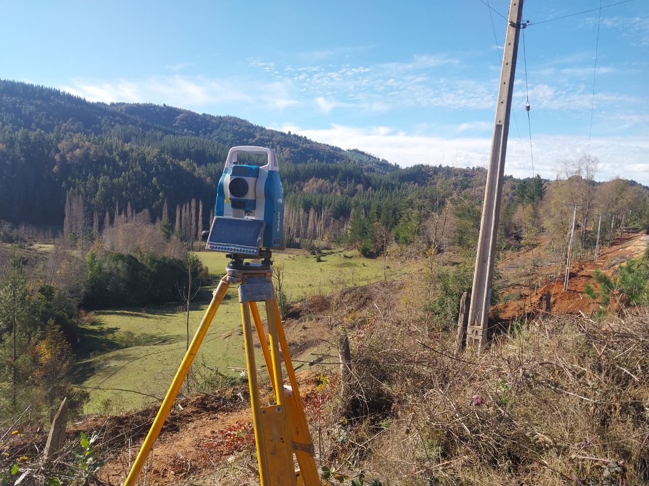 APEKS AM02i surveying hilly terrain near high-voltage lines in Chile