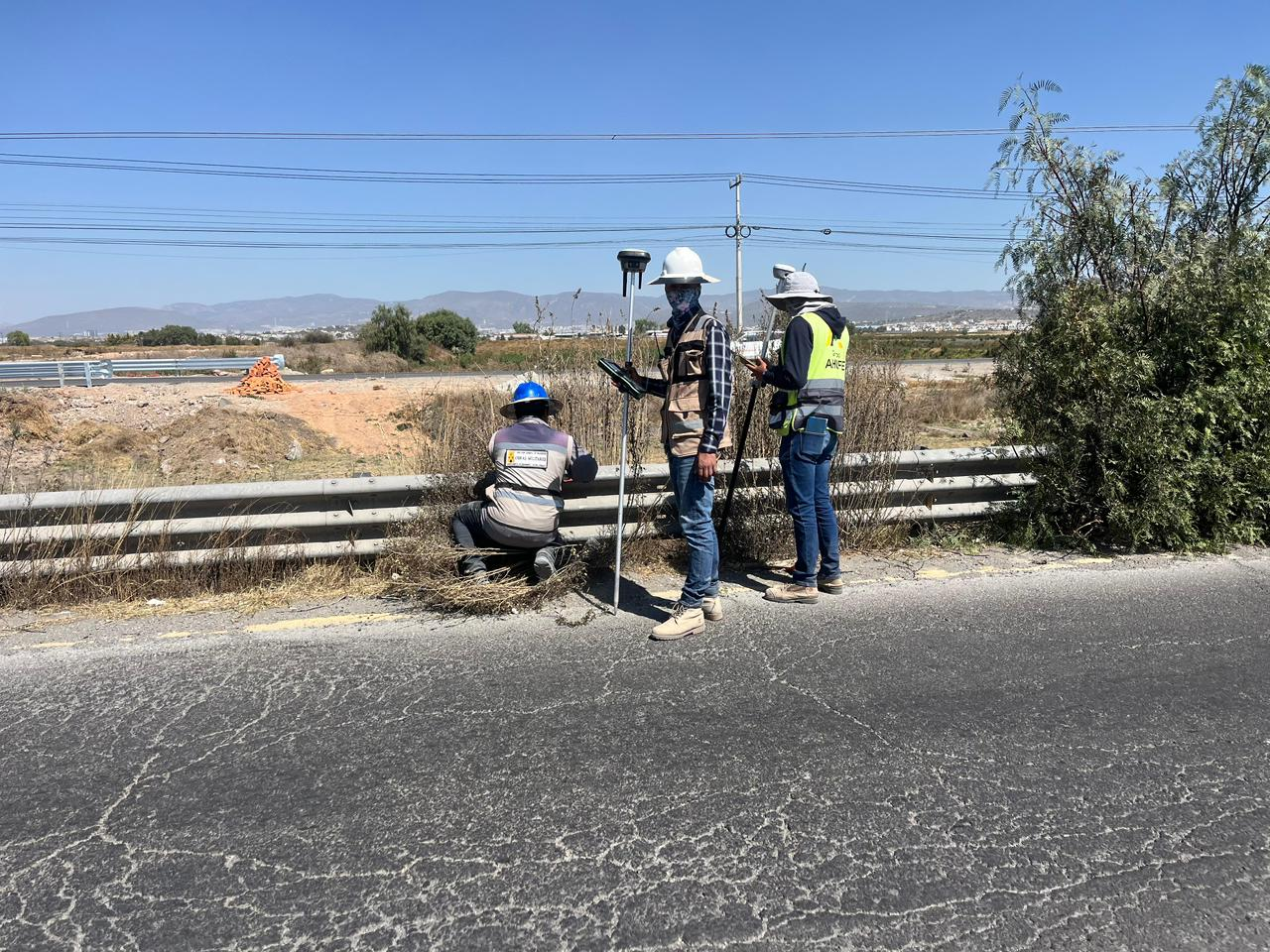 Survey engineers conducting road infrastructure GNSS RTK survey in Mexico