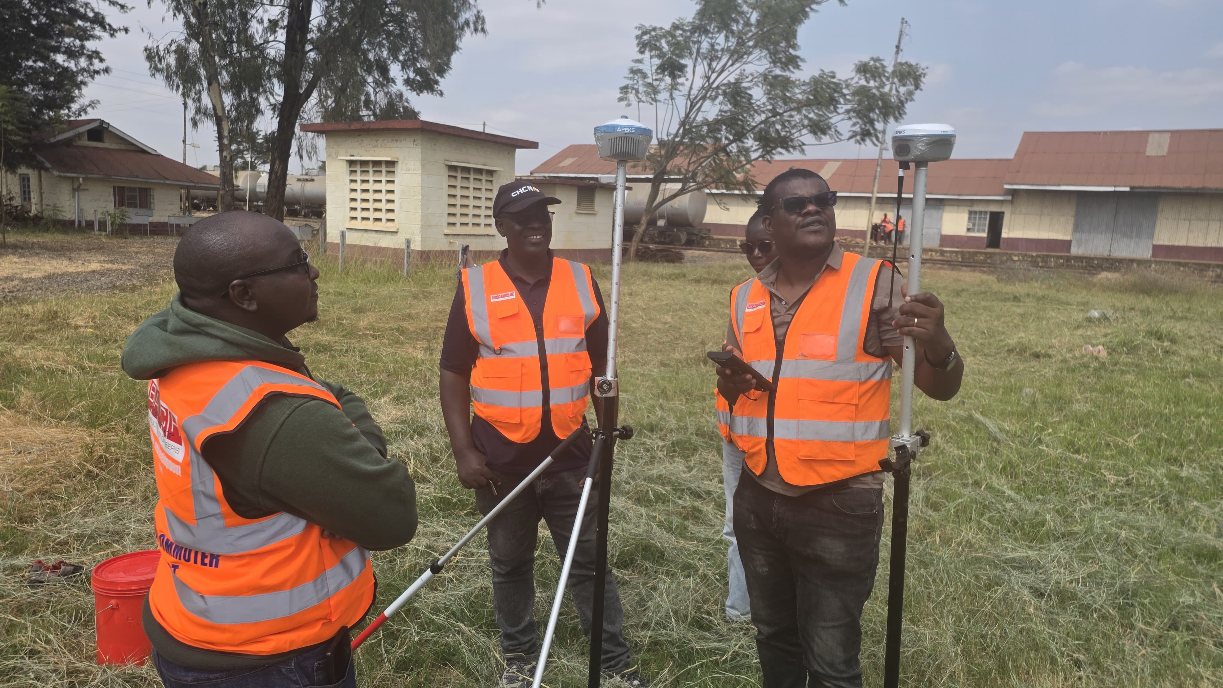 A professional field survey crew setting up APEKS RTK GNSS receivers for a transport infrastructure engineering campaign in Kenya