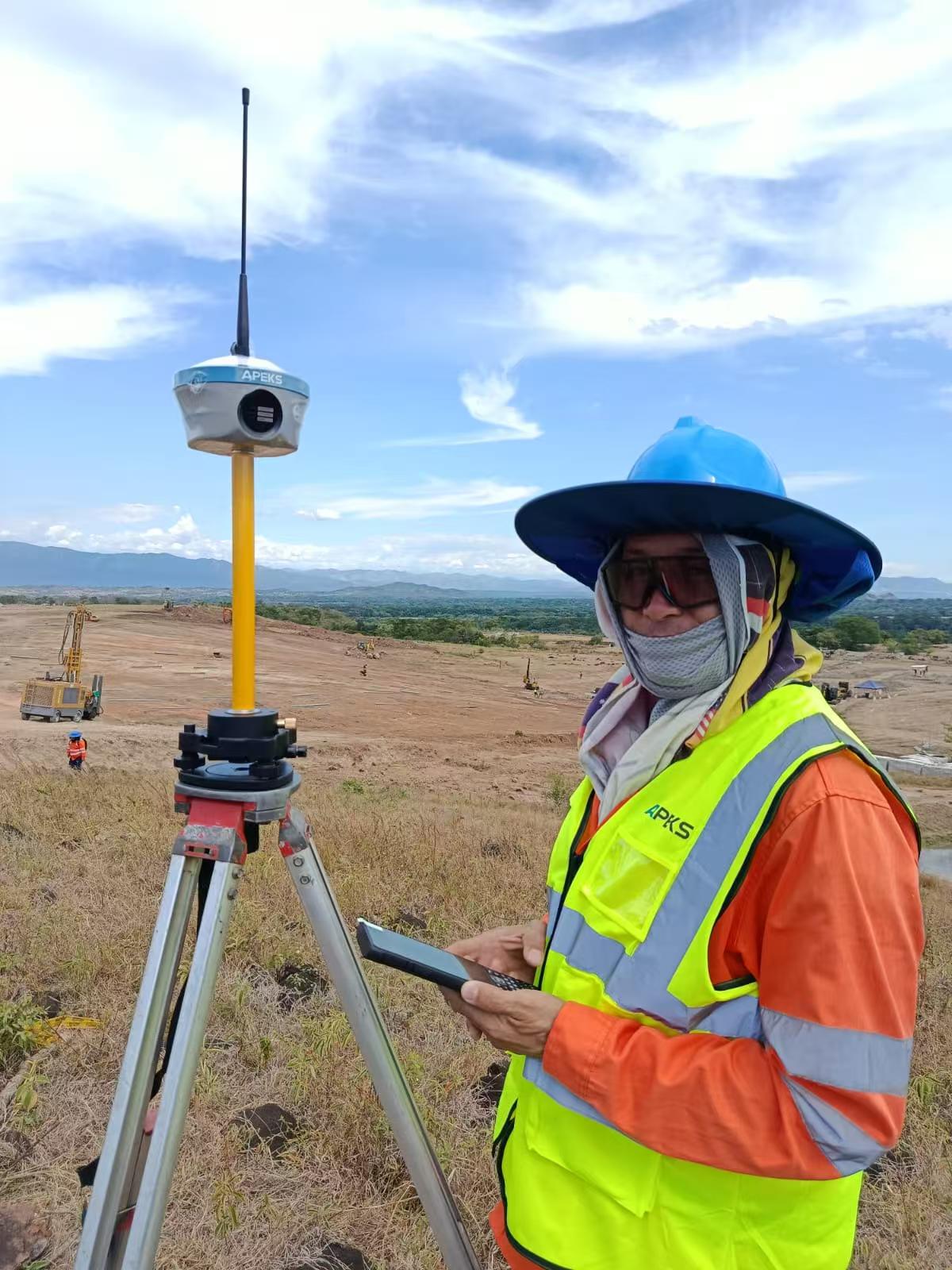 Surveyor using APEKS RTK GNSS receiver at Los Venados Solar Park in Colombia