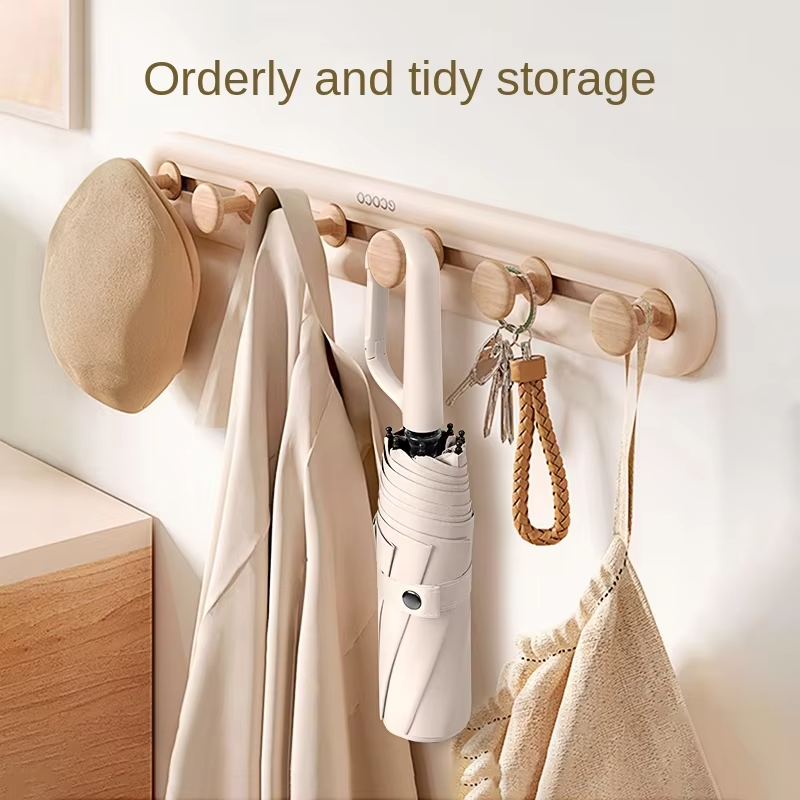 Large foldable umbrella hand carry hanging on the wall